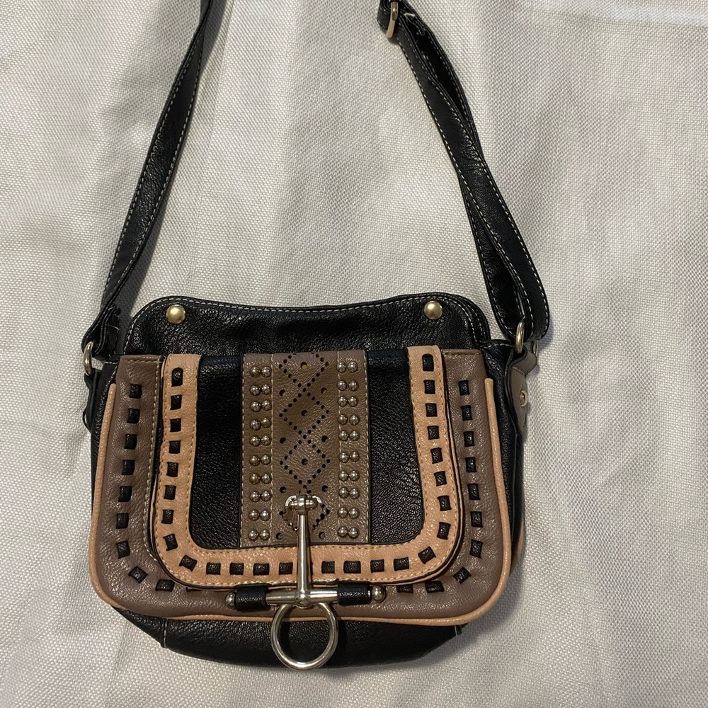 Black and tan crossbody bag with silver designs